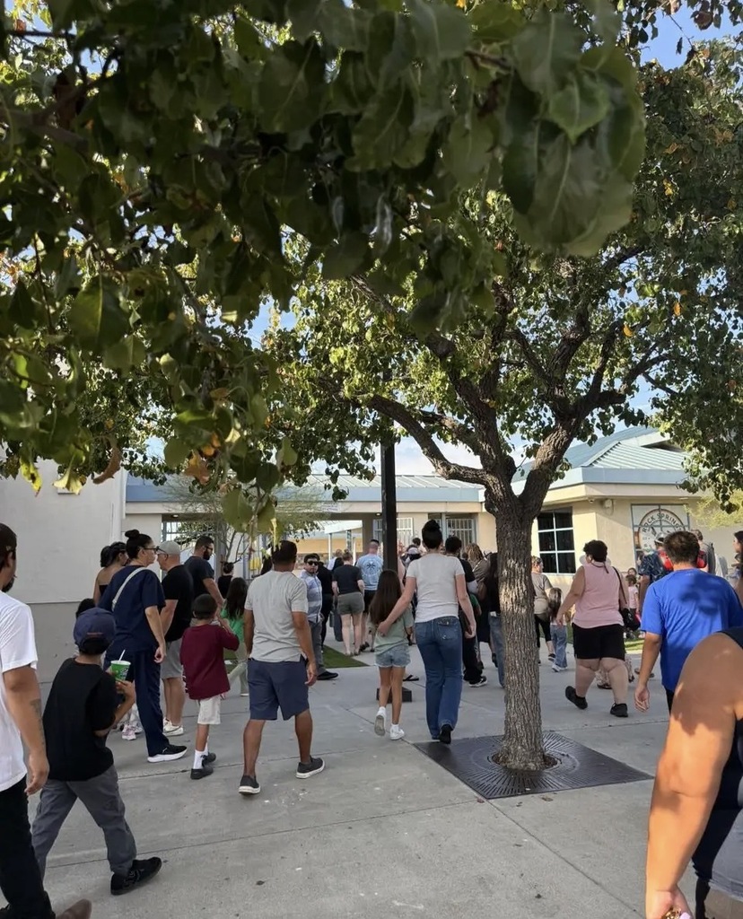 People waking in to Rock Springs School for Back to School Night
