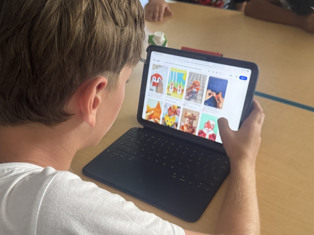student doing research on ipad