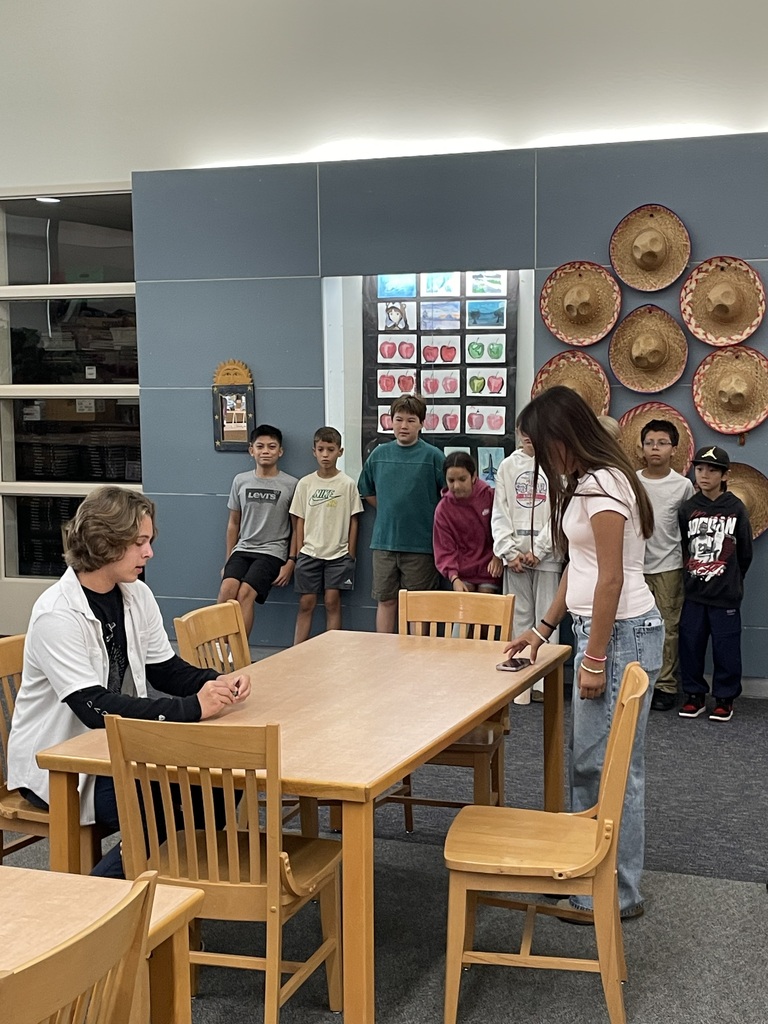 students observing a taping of a news broadcast
