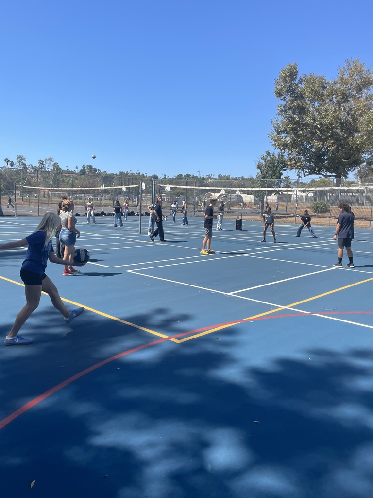 students playing volleyball