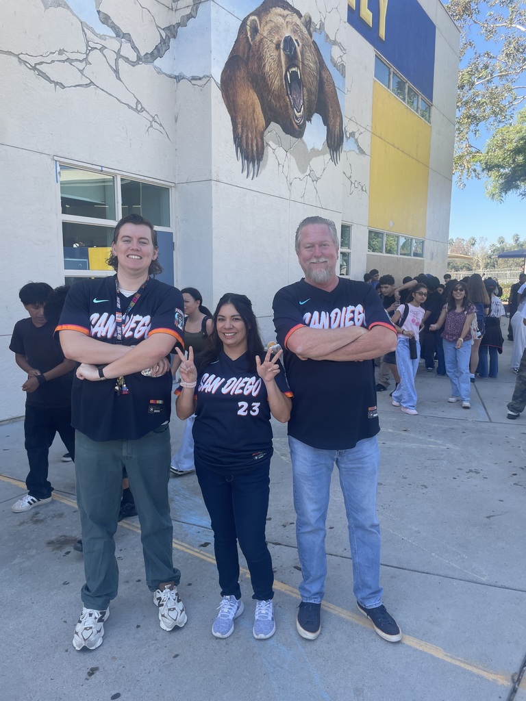 teachers taking pictures with padre jeresys