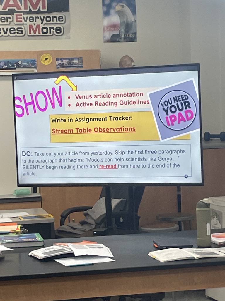 Picture of a slide that asks students to read about Venus and write in their notebooks.  It also asks studetns to re-resd the text from the previous day that will help with the model they are about to create.