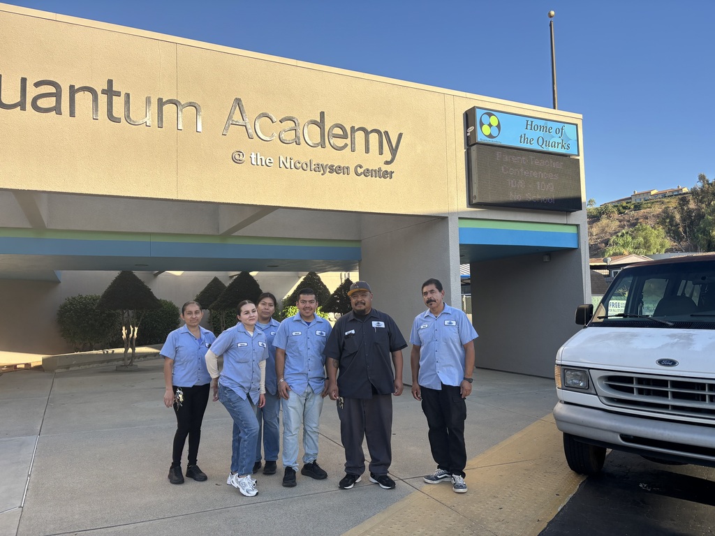 custodians posing outside 