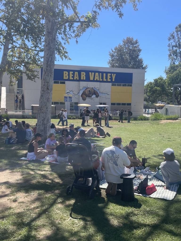 Parents eating in the grassy area