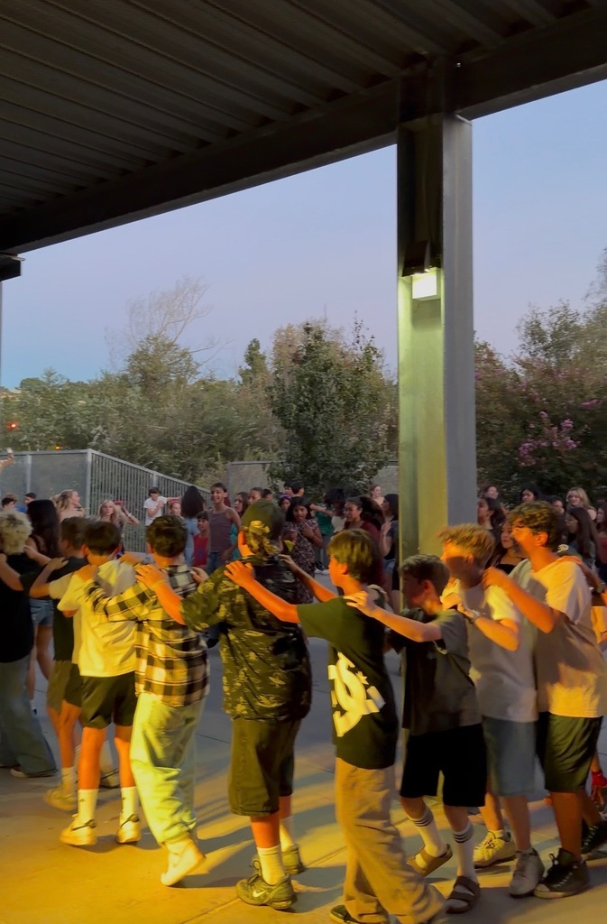 Students dancing in a line