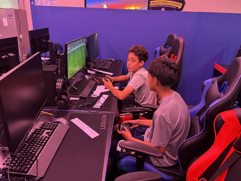 two students playing FIFA