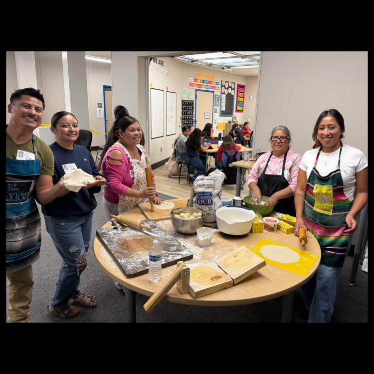 A group photo of the parent volunteers who helped demonstrate the tortilla making process