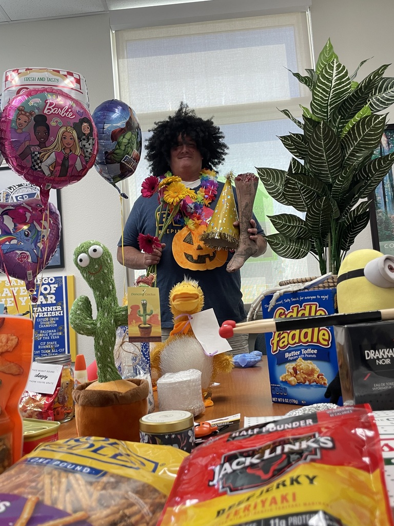 Picture of principal with gifts