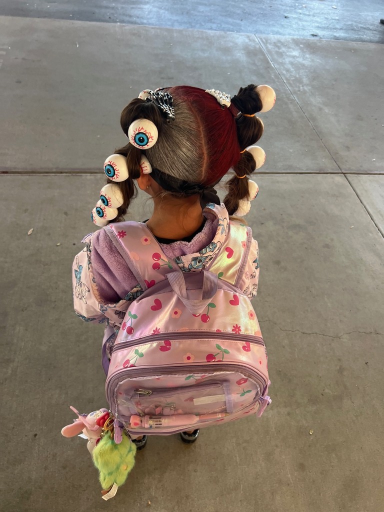 Student with two pig tails and has eye balls on her hair 