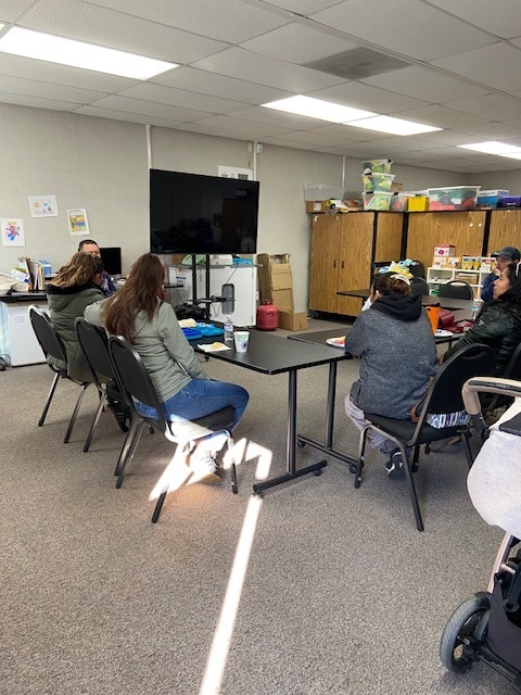 Parents listening to Mr. Lopez's school updates.
