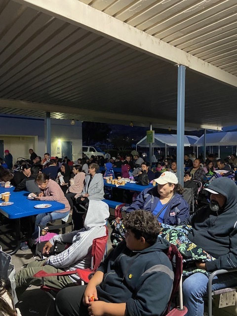 Many people sitting down watching the movie