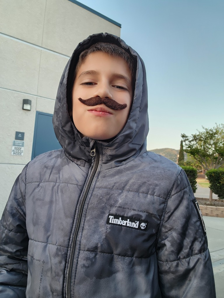 Student Juan Pablo Rios Silva shows off his Mario mustache