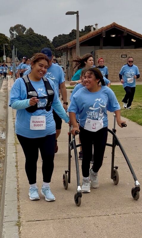 Students, families, and staff participate in the  Girls on the Run 5K.
