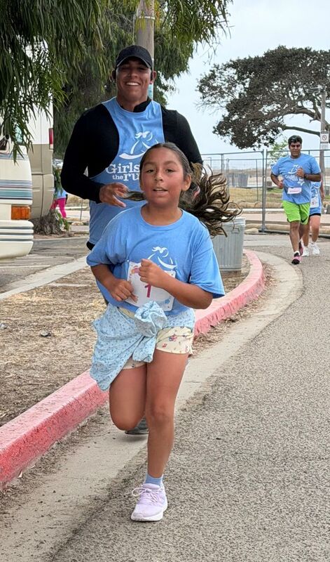 Students, families, and staff participate in the  Girls on the Run 5K.