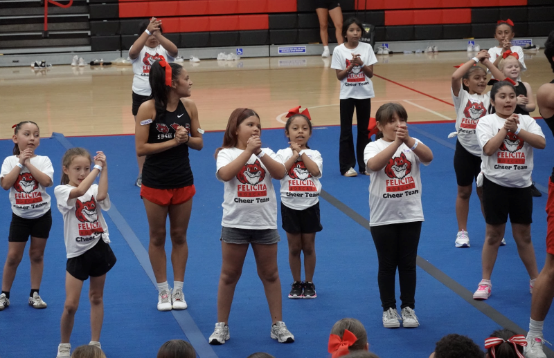 The Felicita Elementary cheer team peforms with San Diego State University cheeleaders.
