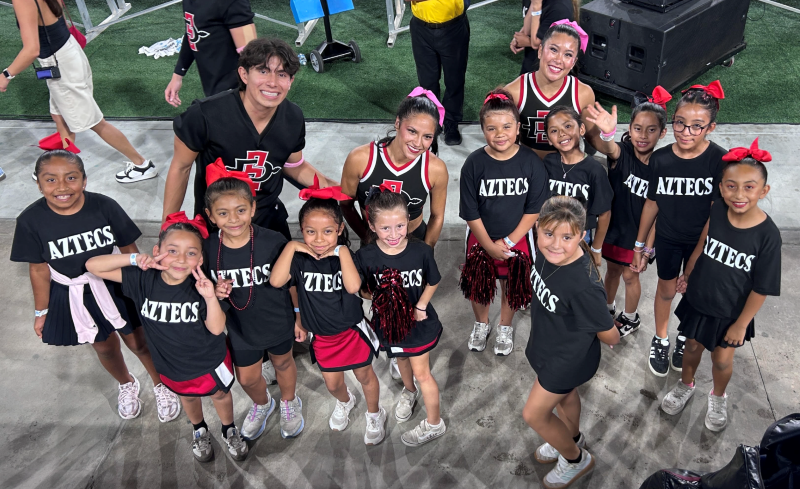 The Felicita Elementary cheer team poses with San Diego State University cheeleaders.