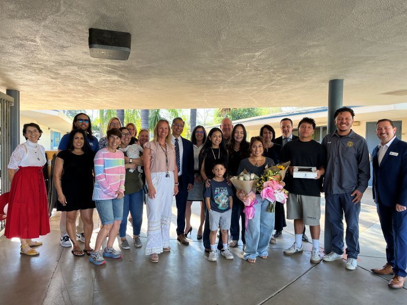 School Office Manager Tracey Meneses is pictured with family and staff as she's recognized as EUSD Classified Employee of the Year.