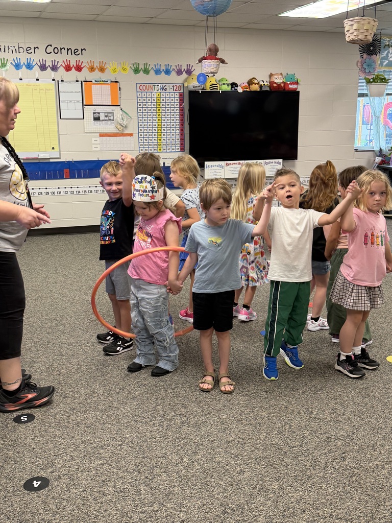 Students passing a hula hoop in a circle