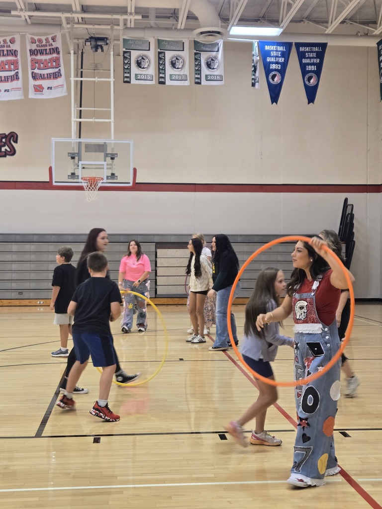 Students and teachers playing hula hoop game