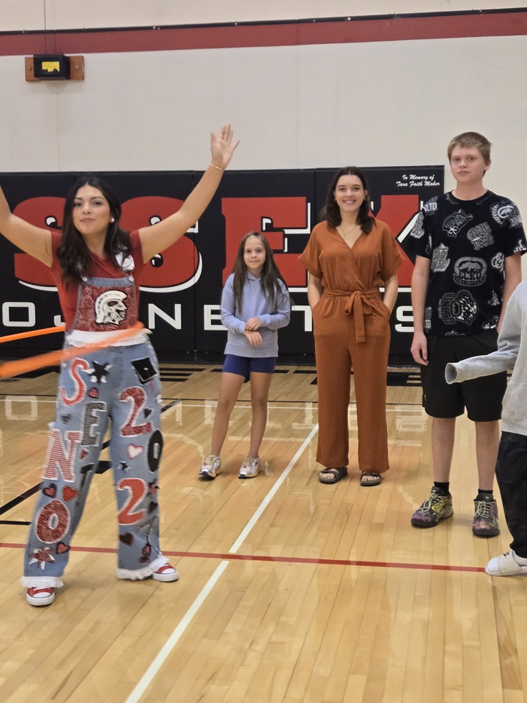 Students smiling for photo in the gym