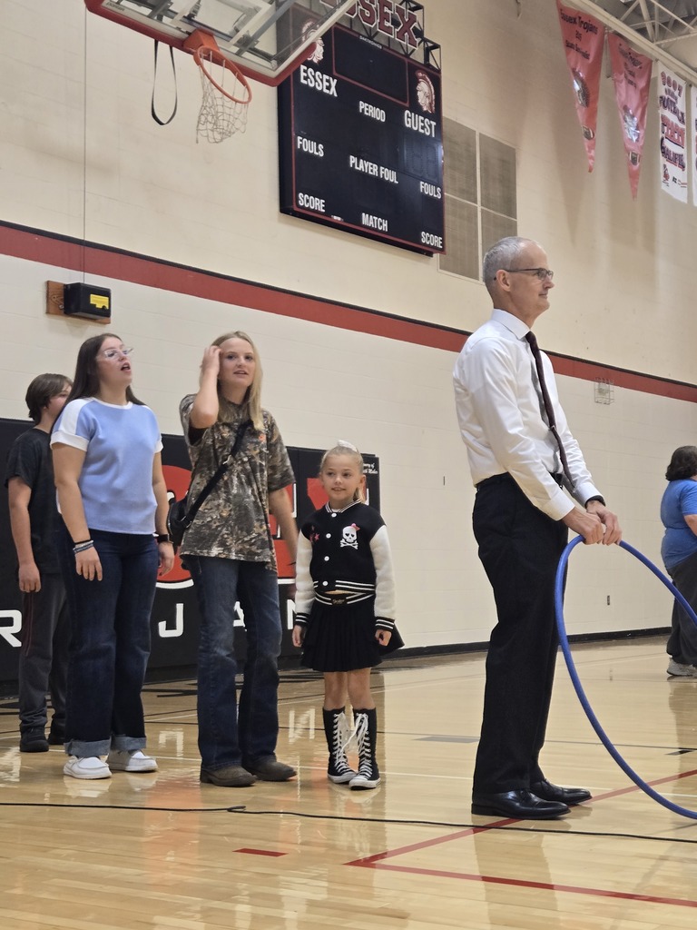 Teacher holding hula hoop with students