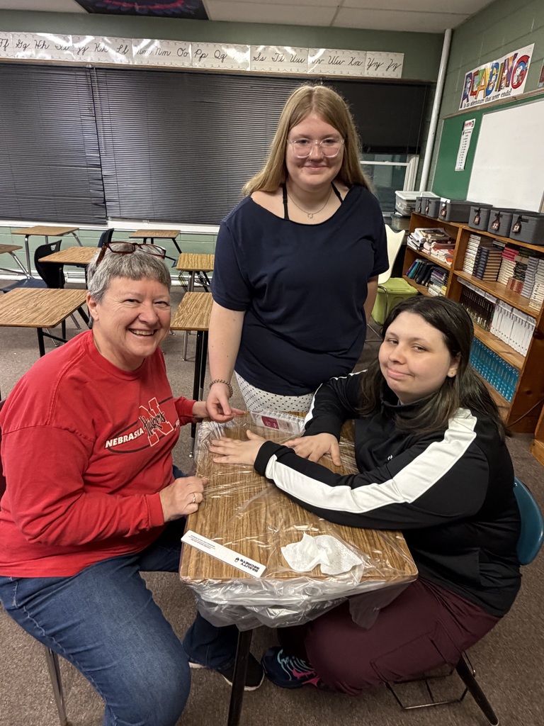 Students learning about nail art with a teacher