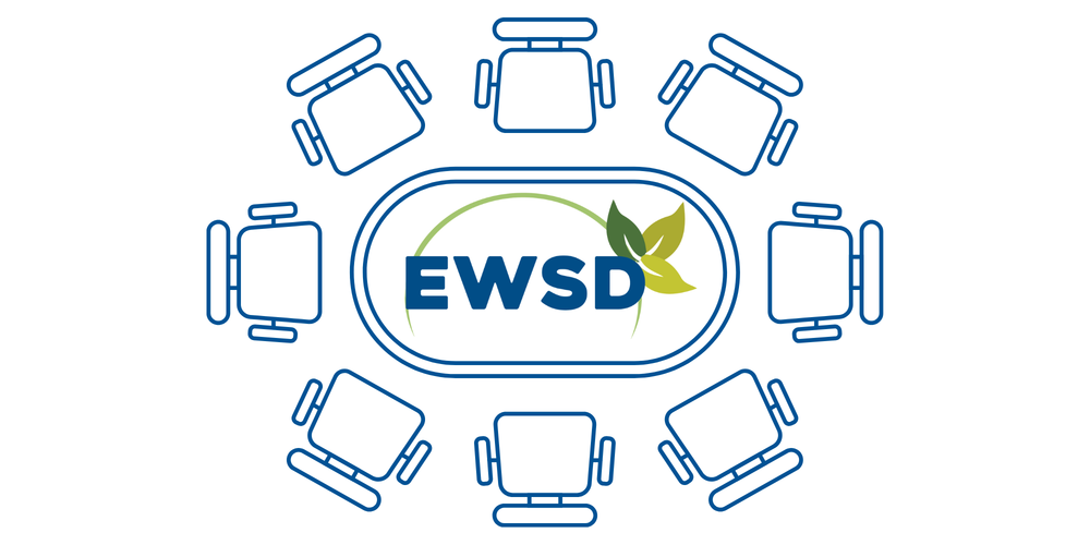Table with chairs and the EWSD logo