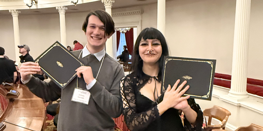 CTE students holding up certificates