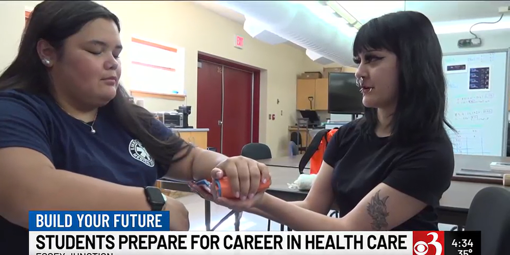 CTE students practicing to put a wrap around a wrist