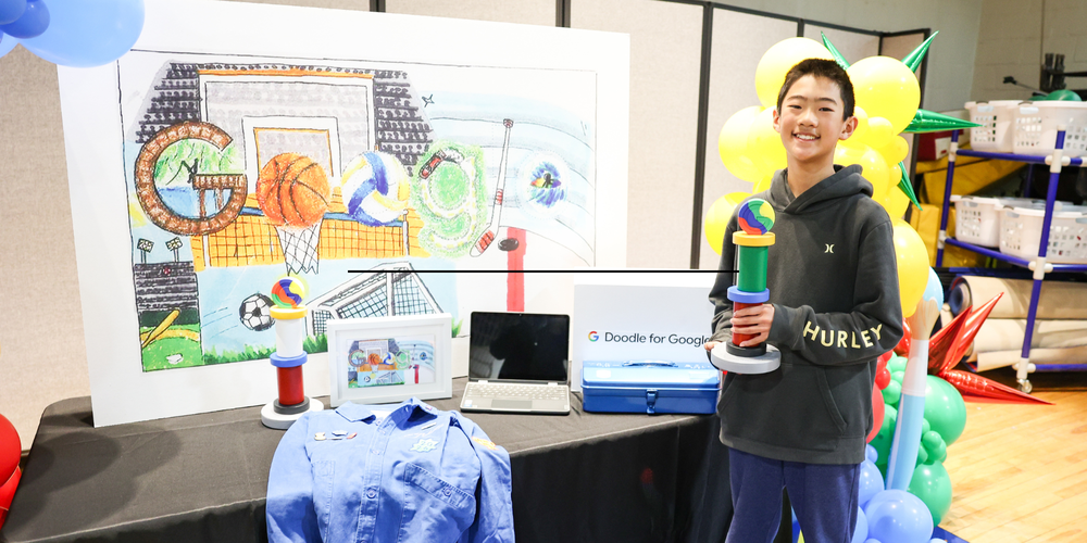 Student receiving an award from Google