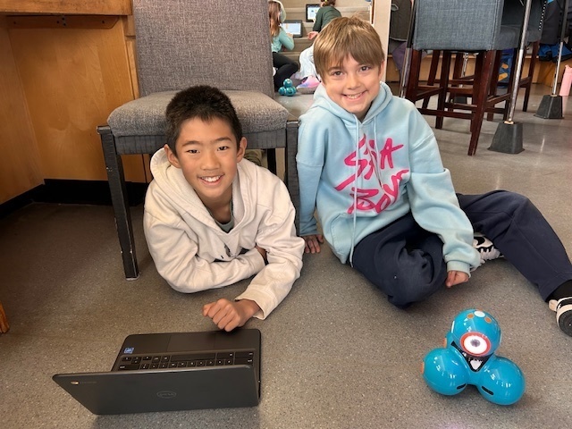 Students using Dash Robots