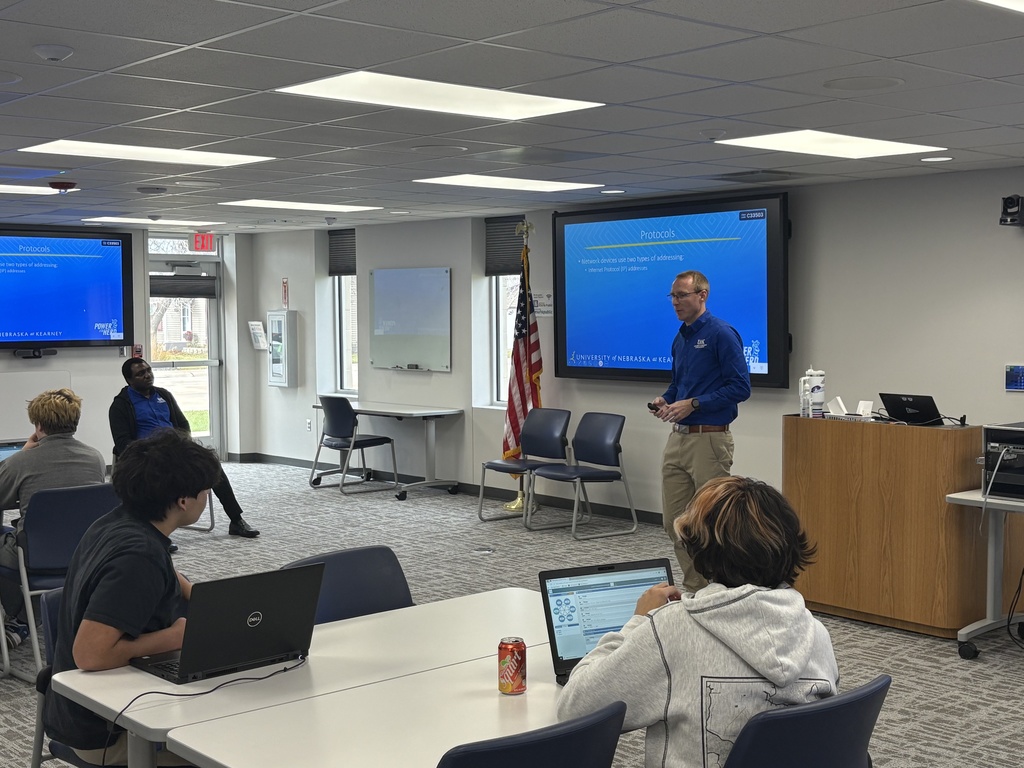 Listening to presenters from UNK