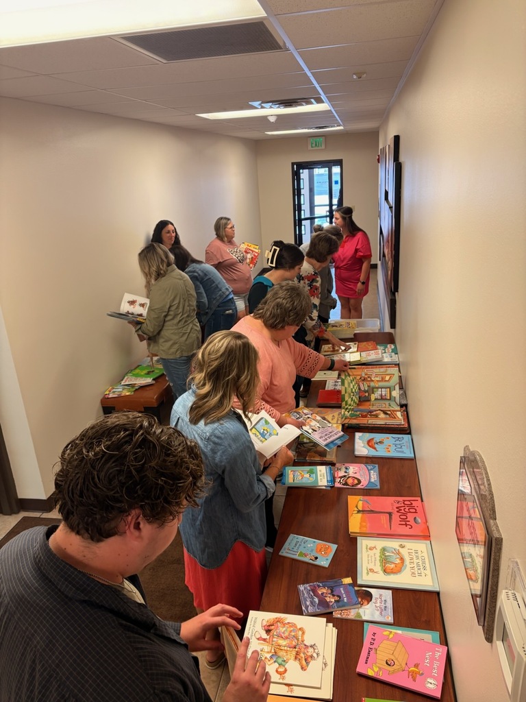Gathering books to send home with students!