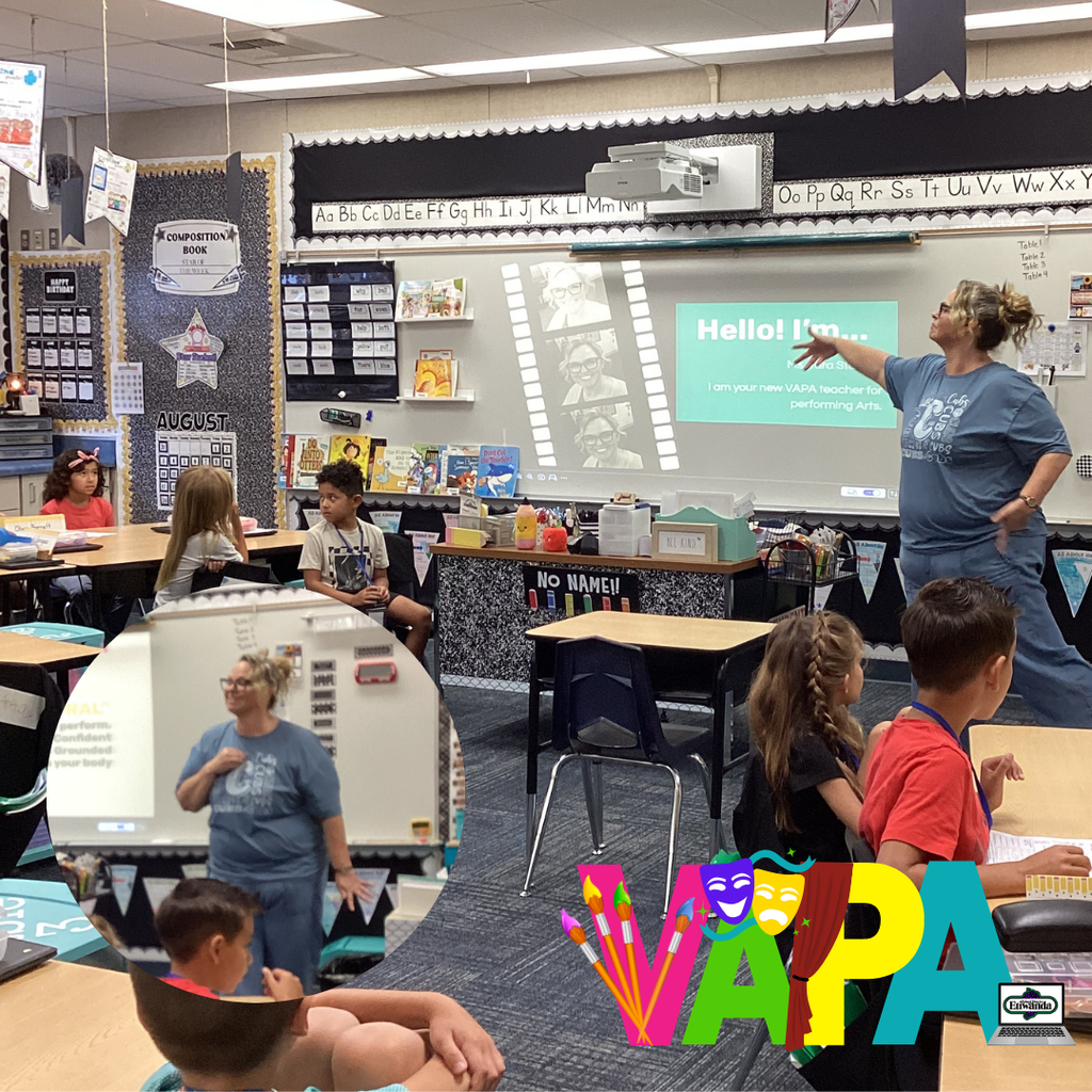 Text: VAPA Image: teacher wearing a blue shirt standing in front of a classroom.