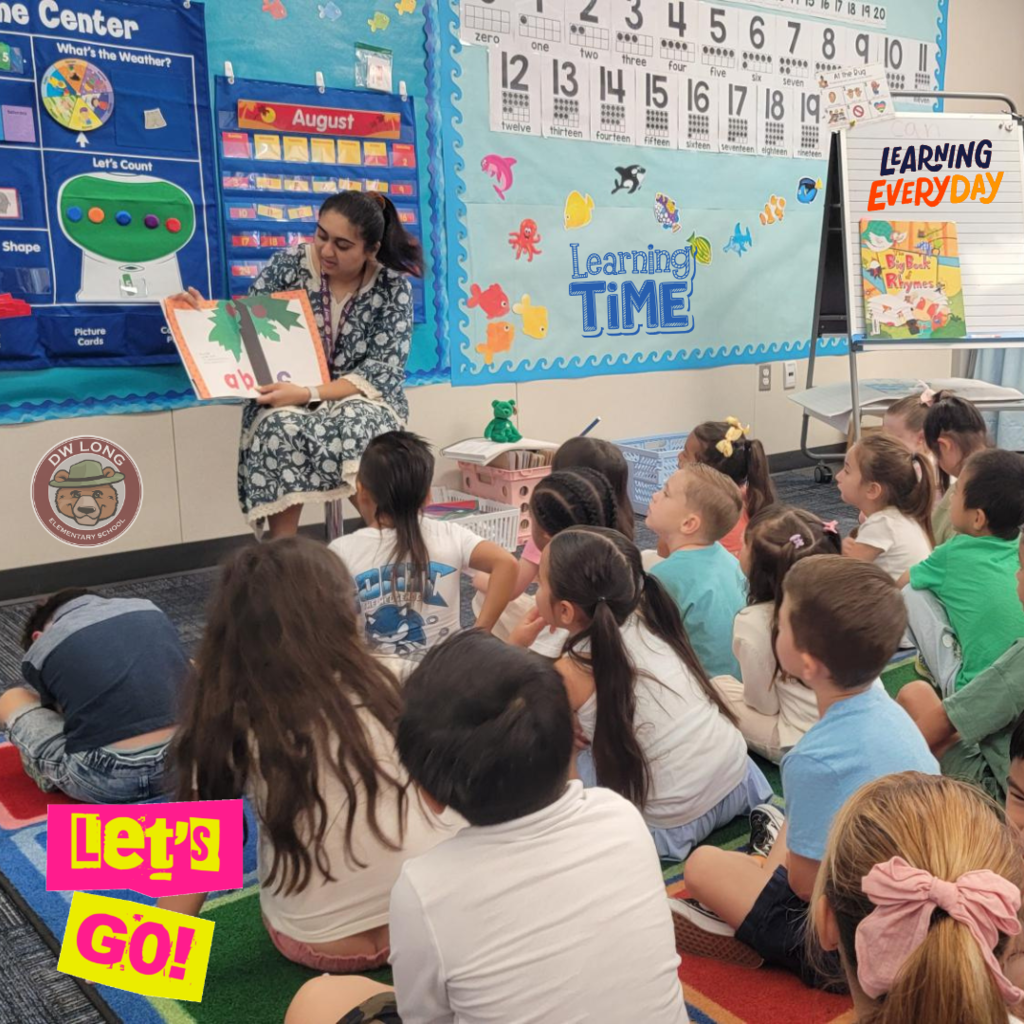 Text: Let's Go, Learning Time, Learning Everyday Image: Teacher reading to her students