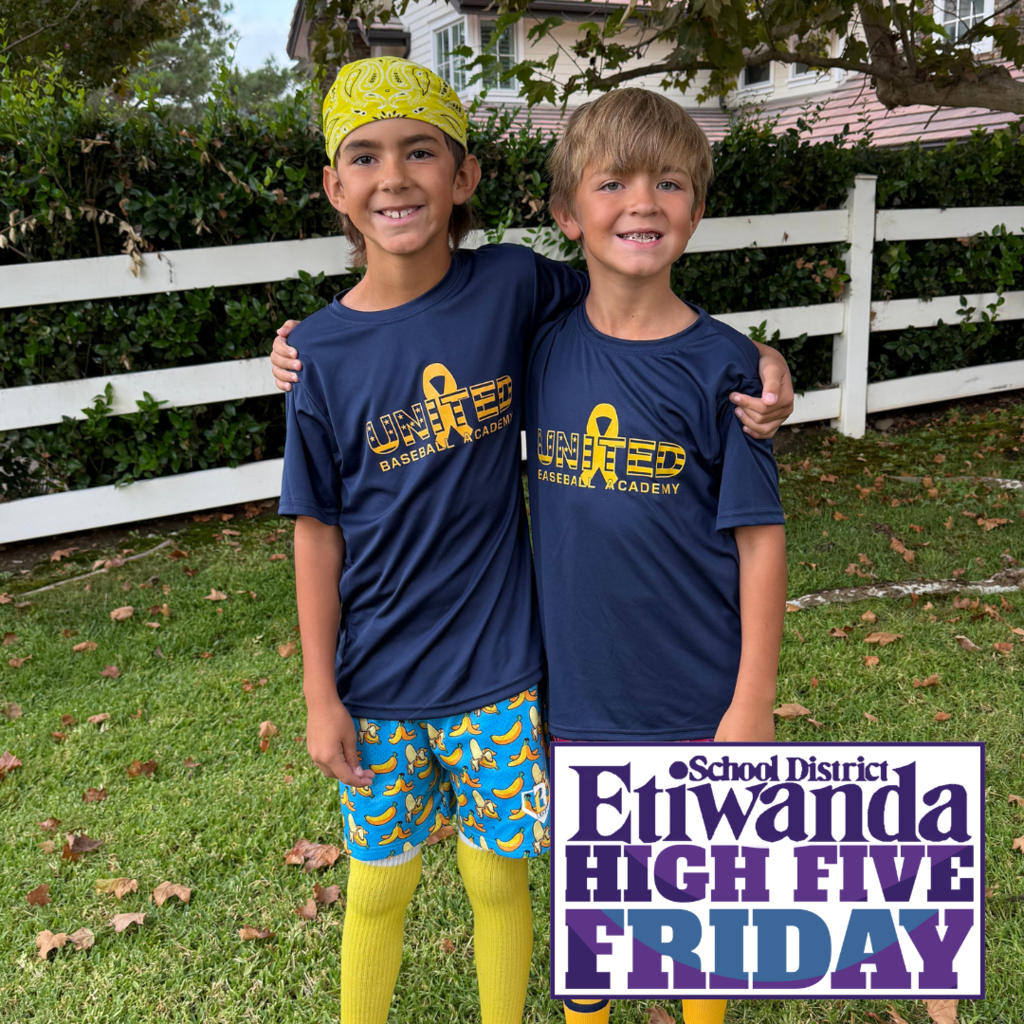 Text: High Five Friday Image: two boys wearing blue and gold
