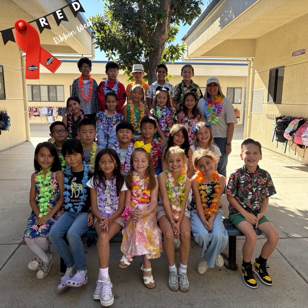 Text: Red Ribbon Week - Students wearing tropical clothes
