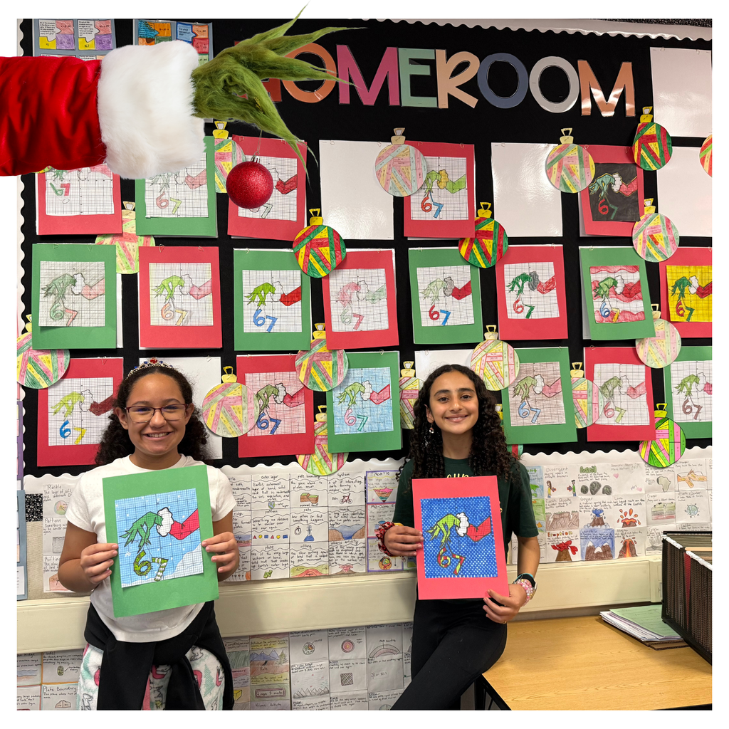 No text Image: two girls holding grinch paintings