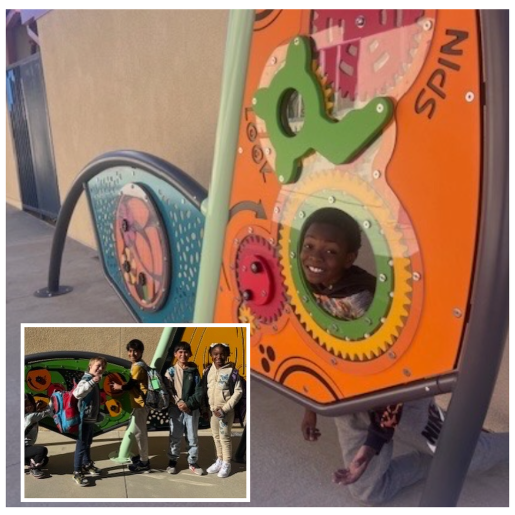 No text Image of smiling students playing with sensory wallls