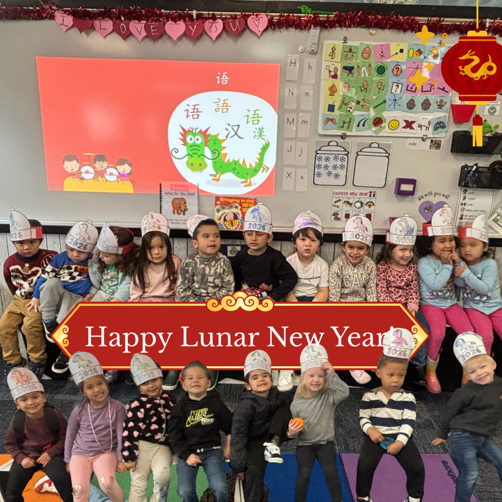Text: Happy Lunar New Year Image: a lot of students smiling wearing Lunar Hats