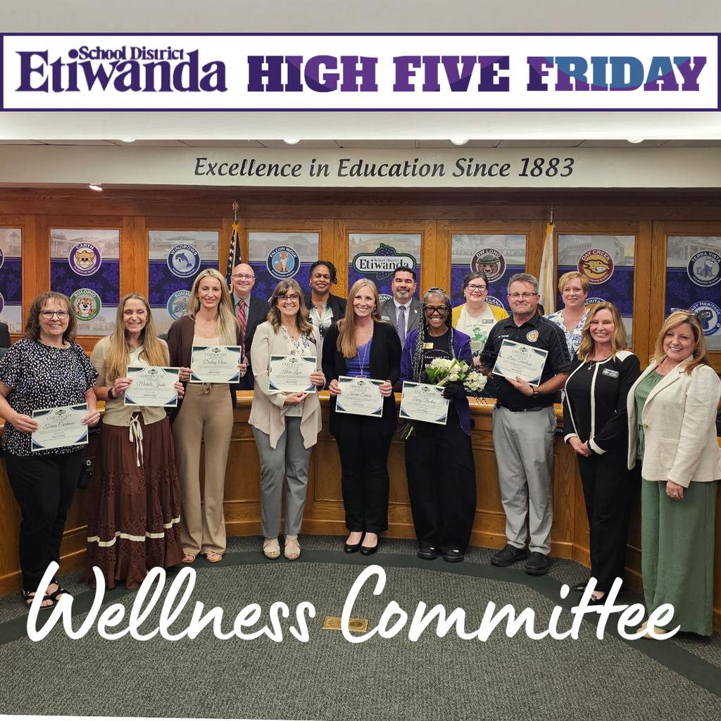 Text: Etiwanda School District, Wellness Committee Image: 14 people standing in a boardroom smiling