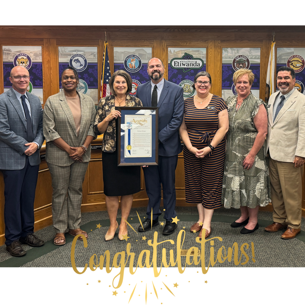 text: Congratulations Image: 7 adults in suits smiling in a board meeting