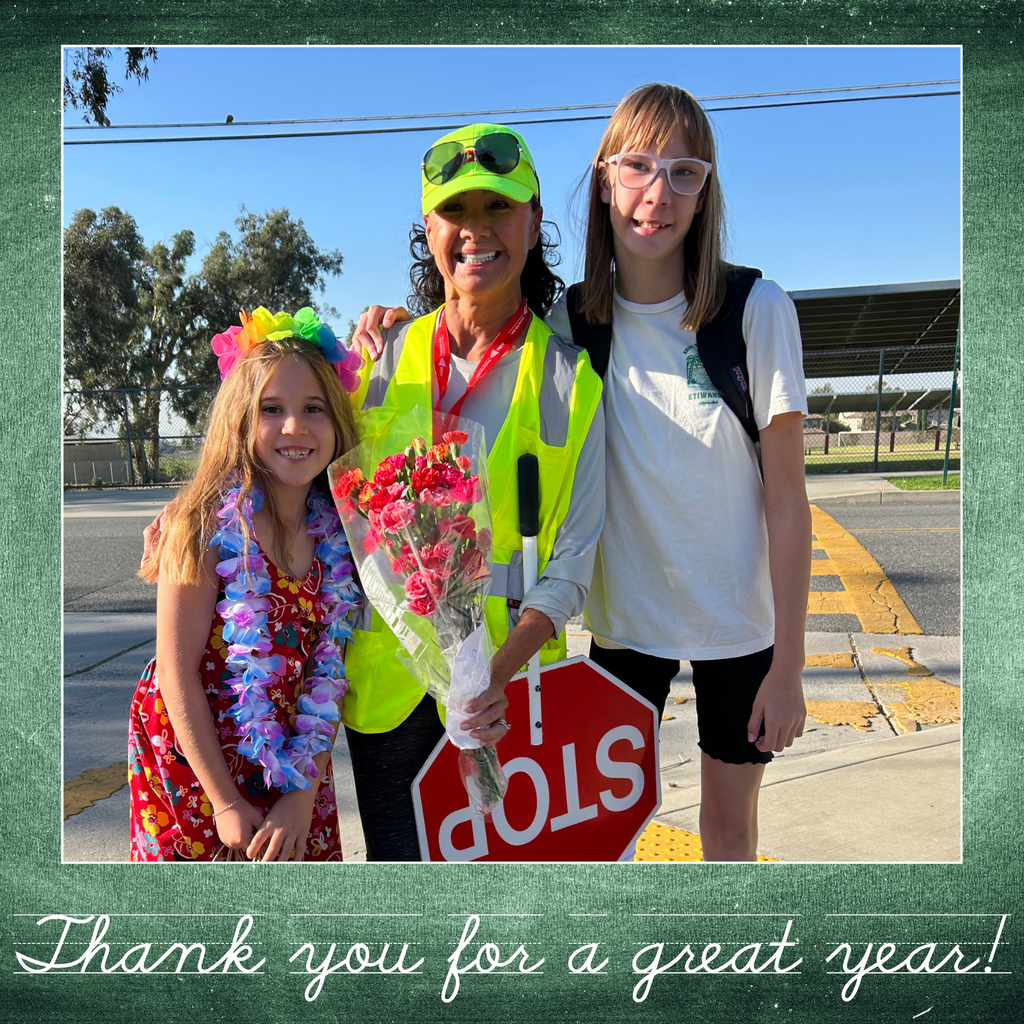 Text: Thank you for a great year. Image: crossing guard female smiling with two students