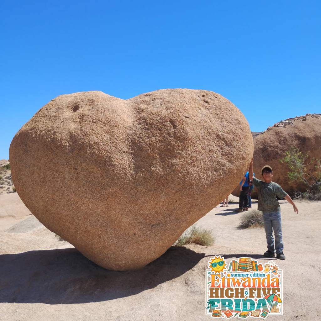 Text: Summer Edition High Five Friday Image: boy standing next to huge heart shaped rock