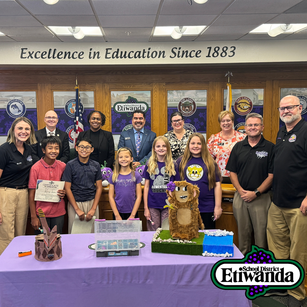 Text: Excellence in Education since 1883 Image: smiling students in front of board members