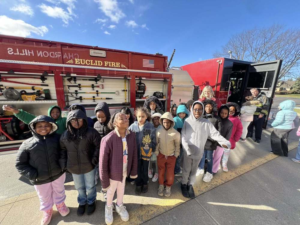 Chardon Hills students standing in front of a Euclid Fire Truck for a group photo during Career Day.