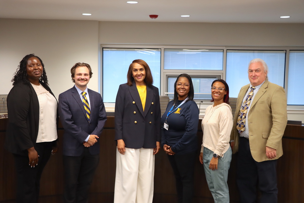 Superintendent Karen Brown with Board Members Tia Otoo, Evan Botzki, Selina Wright, Gabrielle Kelly, and Scott Wilson.