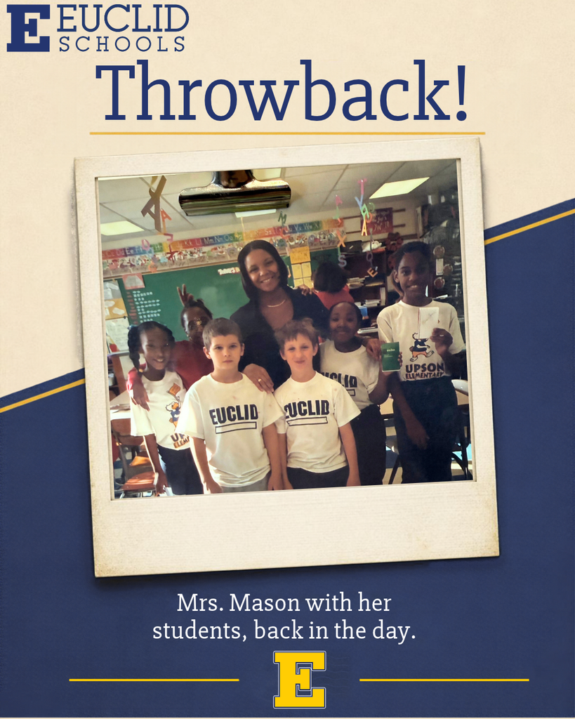 Photo with blue border. A teacher smiles with a group of young students standing in a classroom.