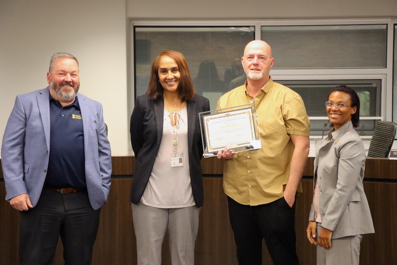 Memorial Options Center Principal Jason Coleman, Superintendent Karen Brown accompanied by  Memorial Options Center Teacher Alex McCahill and Board President Gabrielle Kelly.