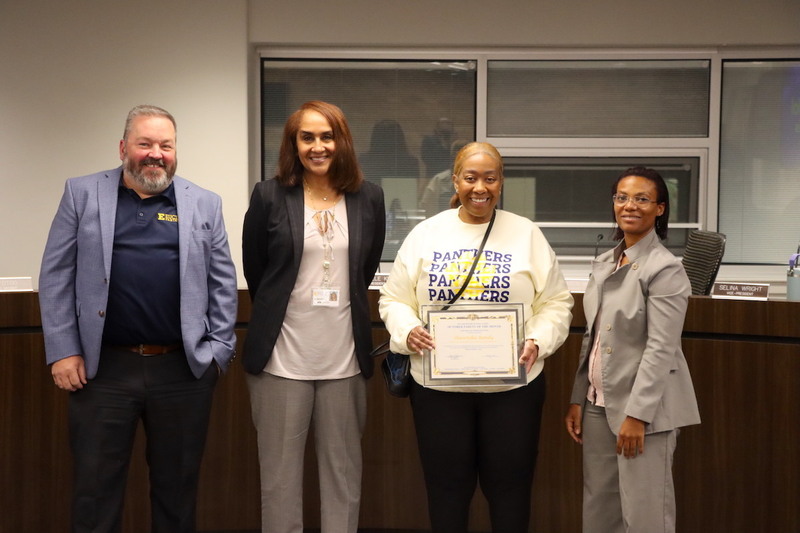 Memorial Options Center Principal Jason Coleman, Superintendent Karen Brown accompanied by a Memorial Options Center Parent and Board President Gabrielle Kelly.